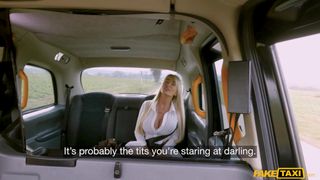 Blonde brit Miss Teela shows off her fake big tits!